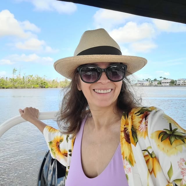 Marilene Elage, founder of ELAGE, on a boat in the Amazon region